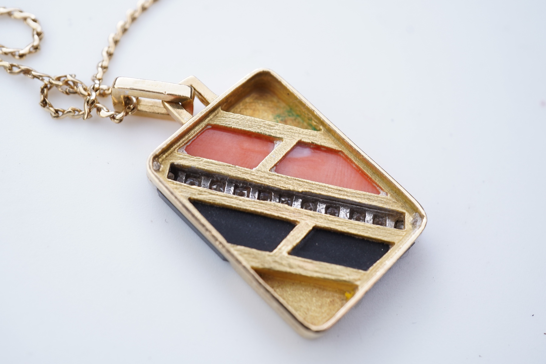 An onyx, coral and diamond demi-parure, circa 1976-7
